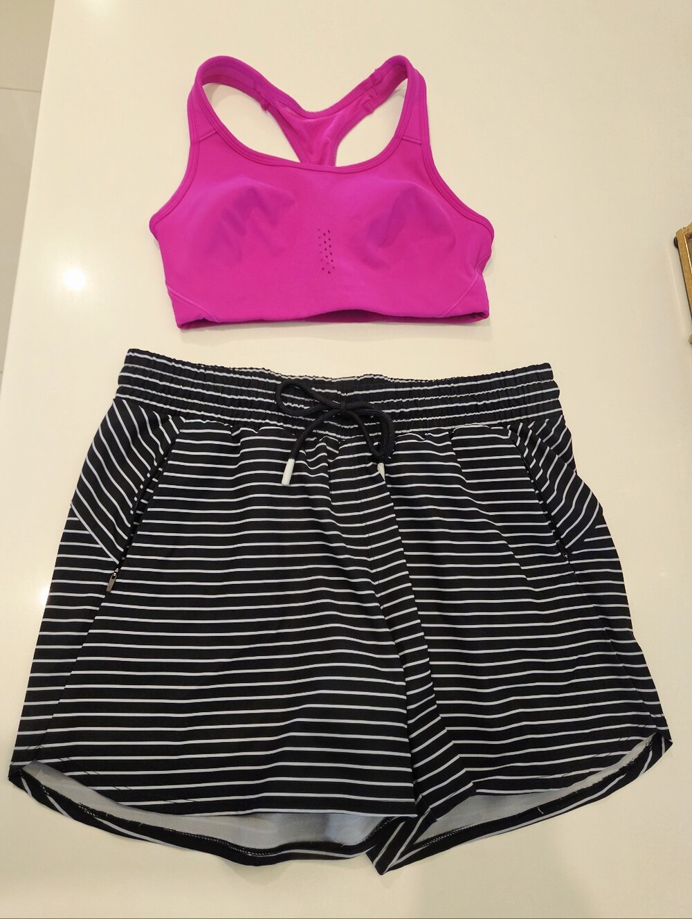 Bright Pink Racerback Sports Bra with Black & White Striped Athletic Shorts